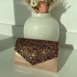Nina glitter envelope clutch in blush pink.
